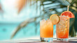 Two cocktails on a summer background