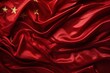 Red Chinese flag made of silk with golden stars