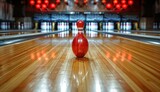Fototapeta  - a bowling ball and pins hitting