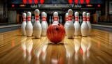 Fototapeta  - a bowling ball and pins hitting