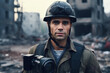 Portrait of man war journalist in bulletproof vest and helmet standing near destroyed buildings
