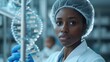 African-American lab technician wearing a medical scrubs and cap in a well-lit modern laboratory looks at a spiral of DNA in a test tube. In the background, the future depicted child is imagined..