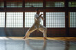 man in white wearing karate uniforms practicing his moves