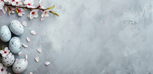 Beautiful Easter Card With Marble Eggs, Cherry Blossoms And Confetti On A Grey Background. Top View