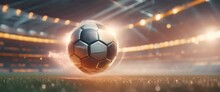 Soccer Ball With A Trail Of Fire In A Stadium. Playing Field Stands Alive With Dramatic Lighting. Panorama With Copy Space.