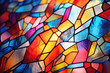 A close-up of a colorful, abstract stained glass window