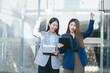 © NINENII - Asian business woman are excited business success with inspiration from their excellent financial results that are happy working on a Tablet.