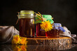 Homemade dandelion honey in jars .  Homemade remedy..It is an antibacterial, anti-inflammatory, antioxidant, and has mild diuretic and prebiotic properties.  