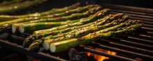 A Closeup Shot Captures The Details Of The Roasted Asparagus Tips, Revealing Their Lightly Charred Exterior And The Slight Curl At The Ends, A Testament To Their Expertly Roasted Tenderness
