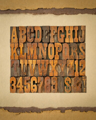 Poster - letters and numbers in vintage letterpress wood type on art paper, alphabet in French clarendon typeset