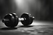 © kardaska - Metal dumbbells on the floor in concept fitness room.