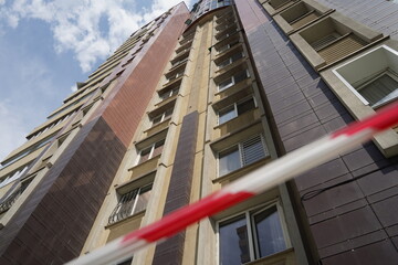 High-rise apartment building with a fencing tape