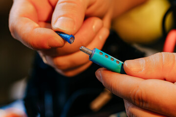 Poster - Male hands holding syringe with thermal paste close up