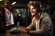 Happy young smiling white man teen boy gamer streamer playing online games in front of computer monitor