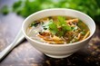 hot and sour soup garnished with cilantro leaves