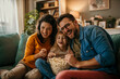 © La Famiglia - The joy of togetherness as a mom, dad, and daughter share a movie and popcorn in their living room