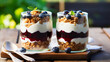 Parfait with blueberry granola and jam in two glass