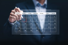 Businessman Manage Time On Virtual Screen Of Calendar For Effective Work. Highlight Appointment Reminders And Meeting Agenda On The Calendar. Time Management Concept.