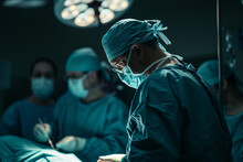 Back View Of A Surgeon Doing A Surgical Operation At Hospital , Surgery In Operating Room Concept Image