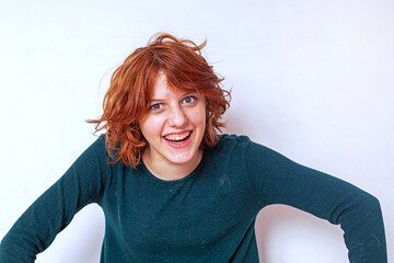 close-up portrait of a pensive teenage girl with red hair with a stylish anime hairstyle