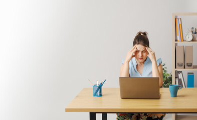 Exhausted woman having a headache