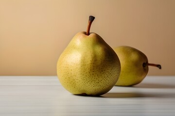 Two ripe red yellow pear fruits isolated on a brown and white  surface