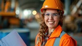 Fototapeta  - Young woman construction worker wear safety uniform