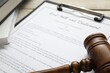 © New Africa - Last Will and Testament, books and gavel on white table, closeup