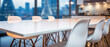Wooden table corporate office bokeh background, empty wood desk surface product display mockup with blurry abstract business city view work backdrop advertising presentation. Mock up, copy space.