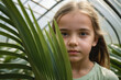 © EliteLensCraftImages - portrait of a girl in greenhouse with leaves