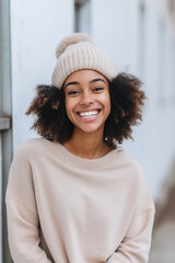 Wall Mural - Smiling beautiful young African American woman wearing knit hat