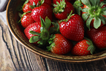 Canvas Print - A bowl with ripe bright strawberry in rustic style