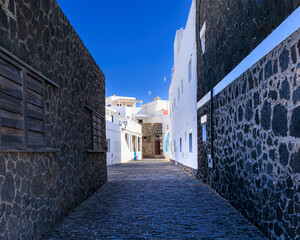 The narrow street Calle Requena in the fishing village El Cotillo, Fuerteventura