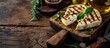 Grilled Rennet or Coalho cheese on a wooden board. Copy space image. Place for adding text