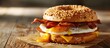 Hearty Breakfast Sandwich on a Bagel with Egg Bacon and Cheese. Copy space image. Place for adding text