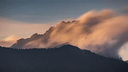 Wall Mural - fast misty clouds motion over alpine rocky peak in magic evening sunset light, long exposure time la