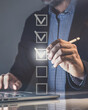 © Fabio Principe - Businessman tick sign mark for assessment. Questionnaire, quality evaluation concept. Online survey