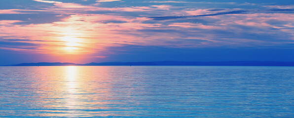 Wall Mural - seascape early in the morning. sunrise over the sea. natural landscape. horizontal banner