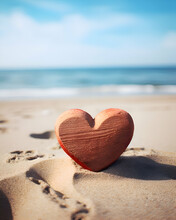 Red Heart On The Beach At Sunset. Valentines Day Concept