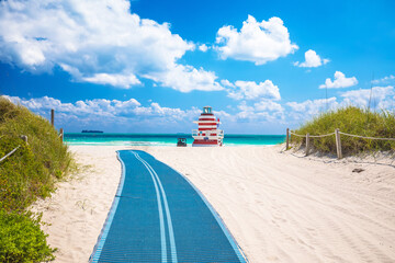 Wall Mural - Miami Beach colorful sand beach and lifeguard post jetty view, Florida