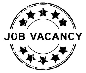 Canvas Print - Grunge black job vacancy word with star icon round rubber seal stamp on white background