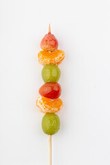 tanghulu, a fruit skewer korean snack candy coated with sugar syrup