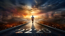 A Solitary Person Strolling During Dawn,,
A Man Walks On A Long Road With The Numbers 2023 On It
