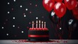 Luxurious black and red themed birthday cake with candles, balloons and confetti, celebration mood