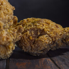 Sticker - Super crunchy fried chicken on a black background. selected focus.