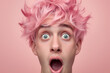 Young Adult with Pastel Pink Hair Surprised on Pink Background