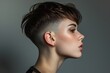 © Geber86 - Profile of young woman with modern short hairstyle and subtle makeup