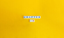 Chapter 2. Book Division, Section, Part, Specified Unit, Portion. Text On Block Letter Tiles On Yellow Background. Minimalist Aesthetic.