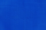 Fototapeta  - Blue wall background. Abstract wall surface with blue plaster texture for design. Close up.