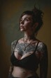 Beautiful tattooed woman is posing for the camera.